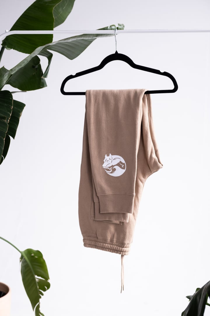 Tan "let's save some dogs" joggers